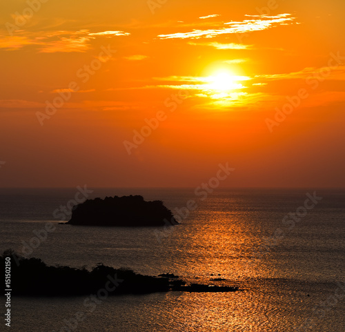 Sunset scene with island in foreground