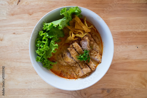 Thai food style: Spicy "TOM YAM"pork noodle soup with lemongrass: chili paste and lime juice