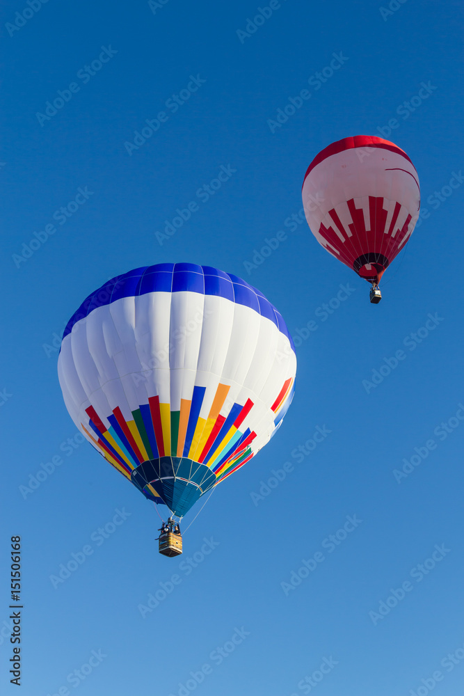 Fototapeta premium Hot air balloons and paraglider