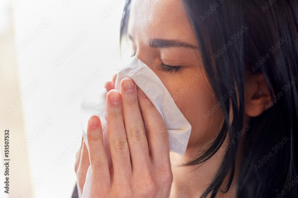 close up of woman with wipe blowing nose or crying close up of woman with wipe blowing nose or crying