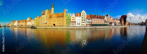 old town of Gdansk - panorama of Motlawa embankment with colorful gothic facades of old houses, Gdansk, Poland