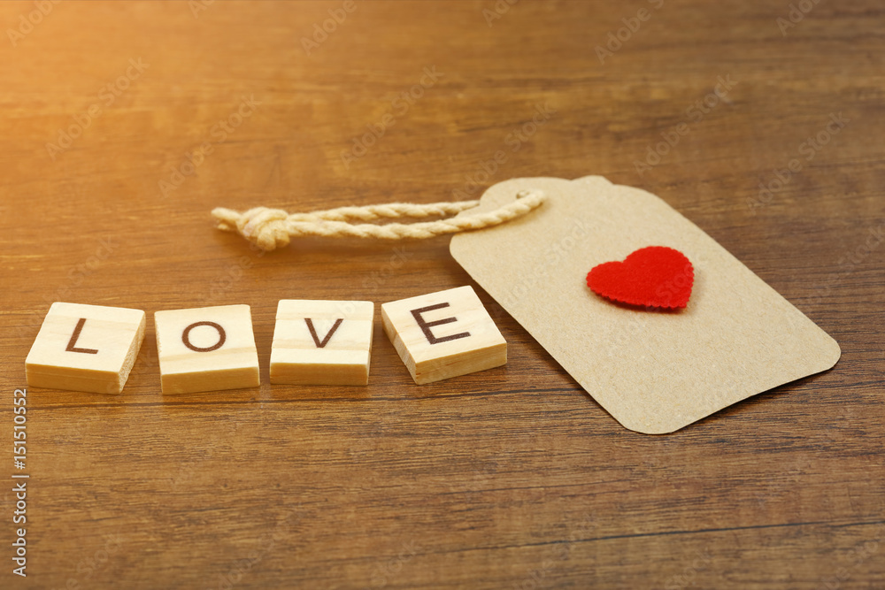 Love wording with red heart sign and paper label Love wording with red heart sign and paper label