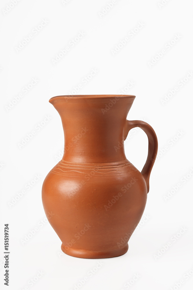 Pitcher ceramic with handle. Isolated on white background. Close-up