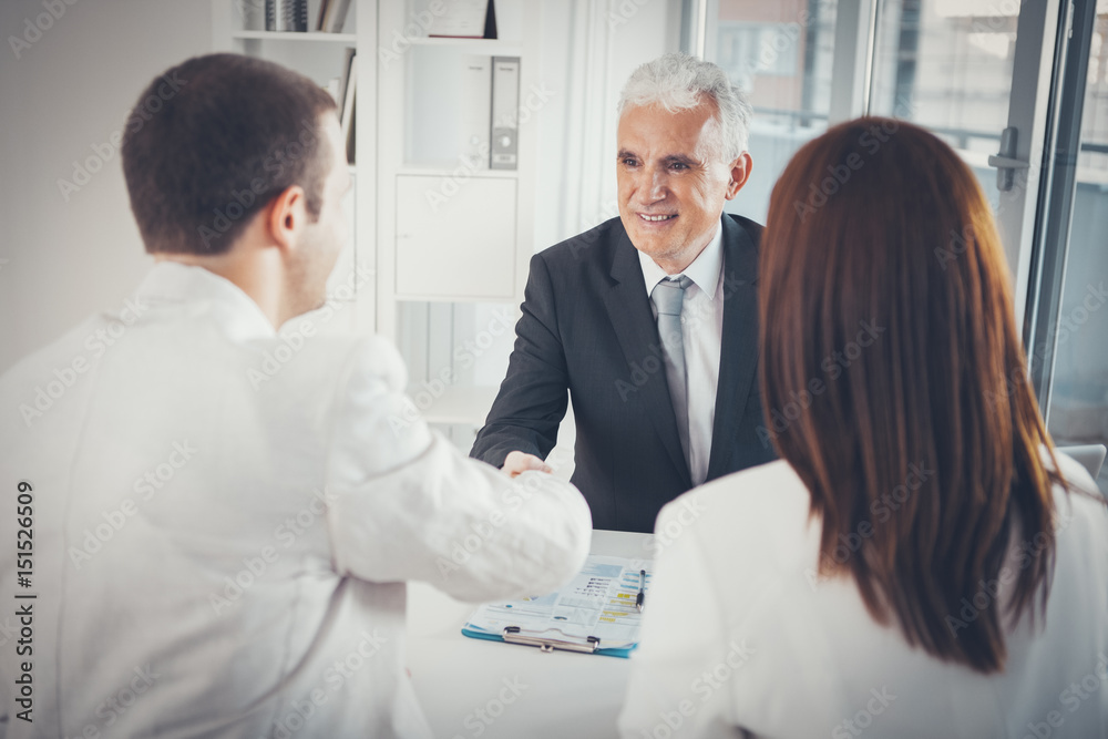 Fototapeta premium Couple With Their Financial Advisor
