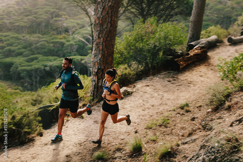 Tela Young couple doing trail running workout