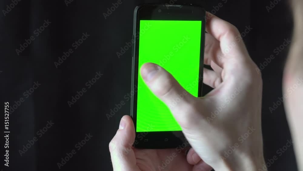 Close-up of male hands touching of smartphone. Green screen Chroma Key. Close up. Tracking motion. Close-up of male hands touching of smartphone. Green screen Chroma Key. Close up. Tracking motion.