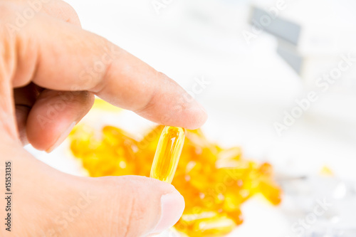 pills with medicine pill bottle close-up on a white background