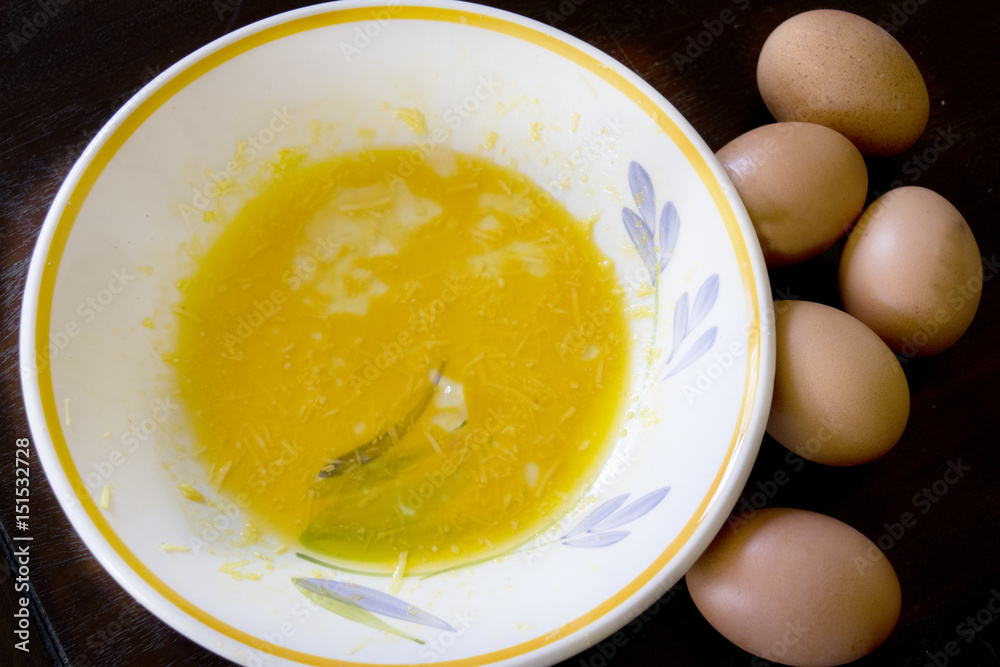 preparing a frittata with beaten eggs and pan preparing a frittata with beaten eggs and pan