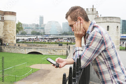 Photography Man check his phone in London