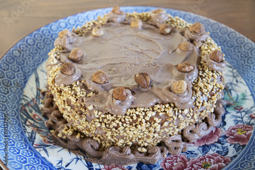 homemade cake with chocolate cream and hanelnut grains