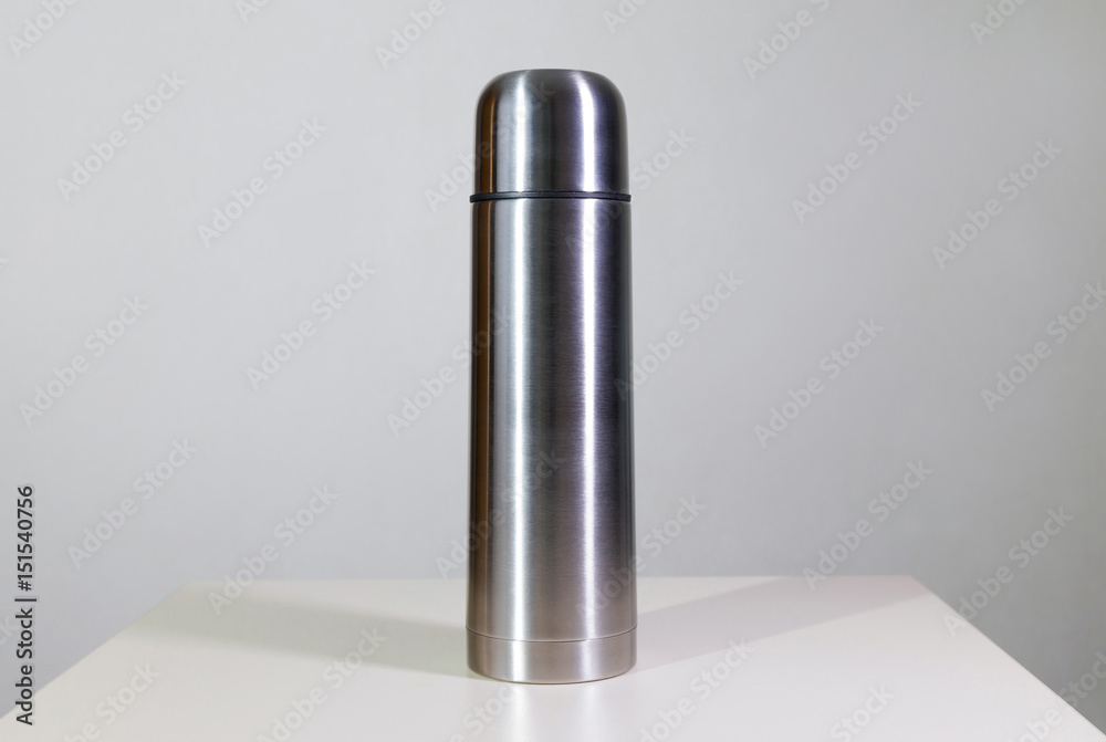 Metal vacuum flask.
Closeup of a stainless steel vacuum flask and its cup on white background. Metal vacuum flask.
Closeup of a stainless steel vacuum flask and its cup on white background.