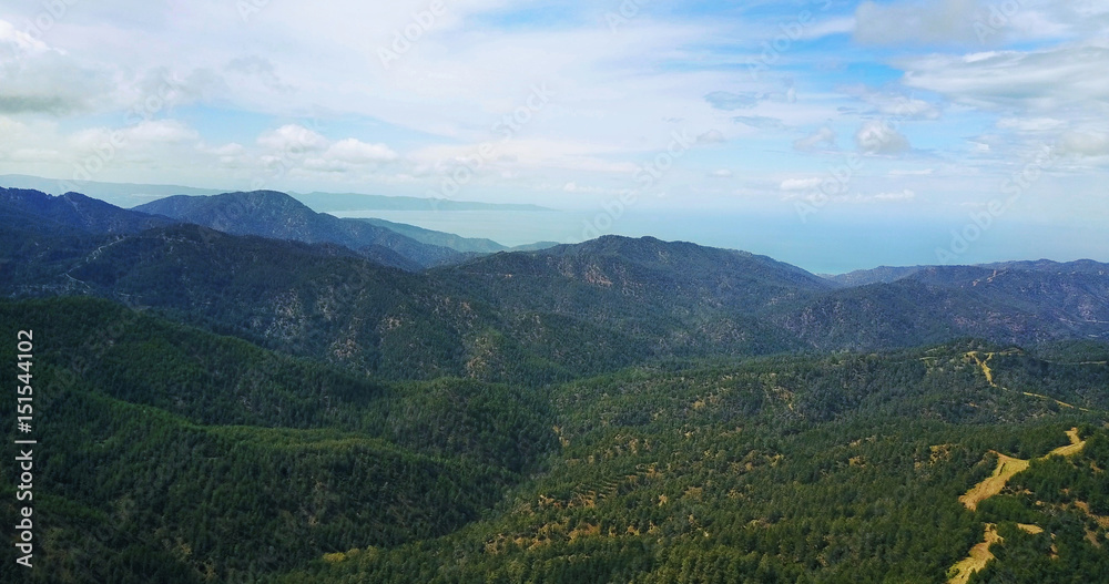 Fototapeta premium cedar valley. landscape of mountains in the mist Cyprus.Drone Point of View Platres in the Troodos. Cyprus. Aerial View. Flying over the mountains