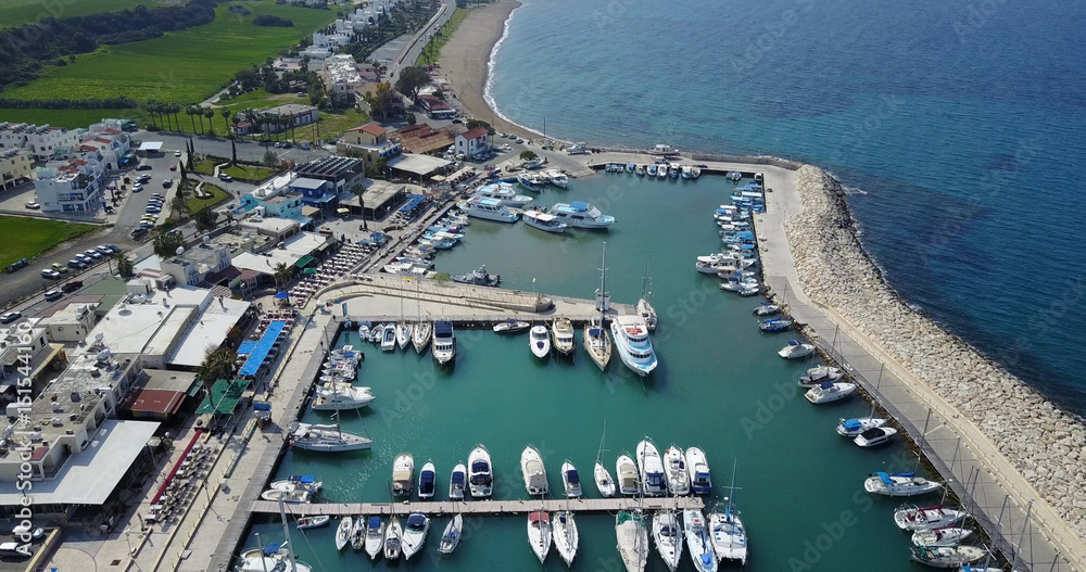 A small seaport. Blue beautiful bay. Cyprus. Resort. Mediterranean Sea. Transportation. Vacation