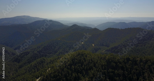 cedar valley. landscape of mountains in the mist Cyprus.Drone Point of View Platres in the Troodos. Cyprus. Aerial View. Flying over the mountains  © Kateryna