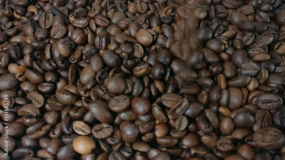 Roasted coffee falling from above onto more whole coffee beans below. Grained coffee fill up space, heap of Rotating Roasted Brown Coffee Beans. Close up. seamless loop, rotation.
Roasted coffee falling from above onto more whole coffee beans below. Grained coffee fill up space, heap of Rotating Roasted Brown Coffee Beans. Close up. seamless loop, rotation.