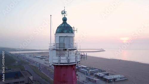 Aerial shot of scheveningen lighthouse with sunset photo