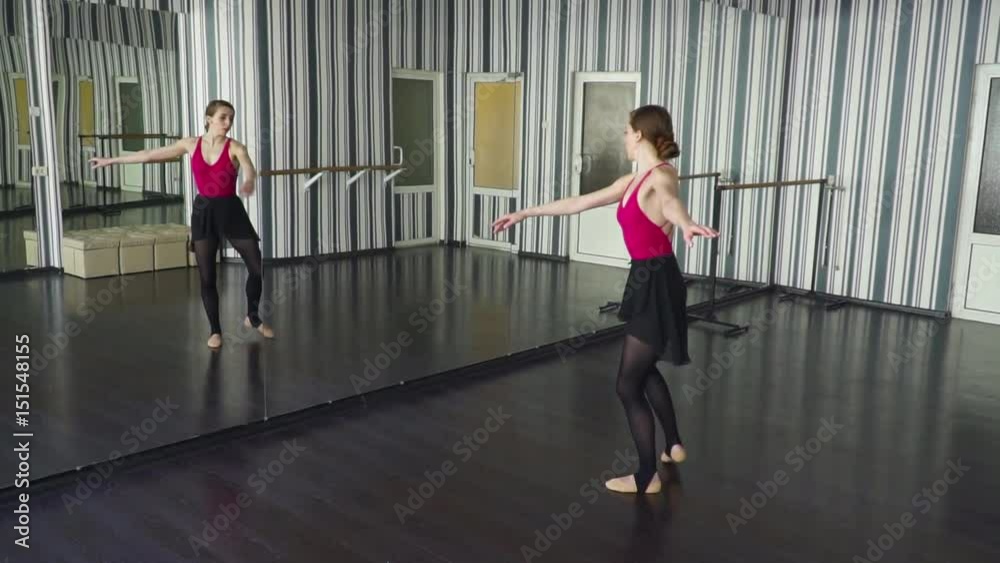 Dancer spinning round in the ballet studio slow motion Dancer spinning round in the ballet studio slow motion