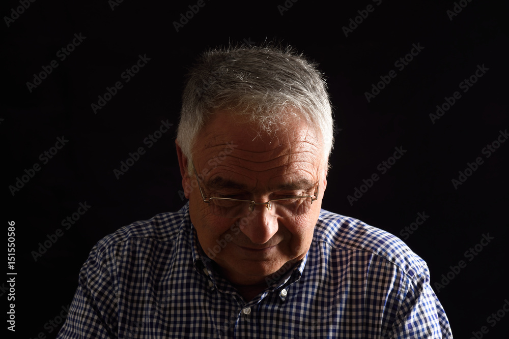 Portrait of a senior man with black background Portrait of a senior man with black background