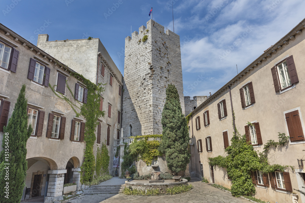 Inner courtyard of the castle Duino with old tower in the middle