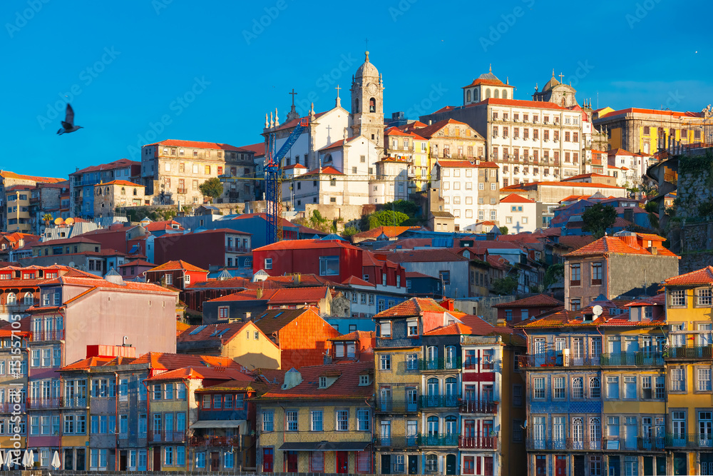 Aerial view with traditional multicolored quaint houses in Old town of Porto in the sunny morning, Portugal Aerial view with traditional multicolored quaint houses in Old town of Porto in the sunny morning, Portugal