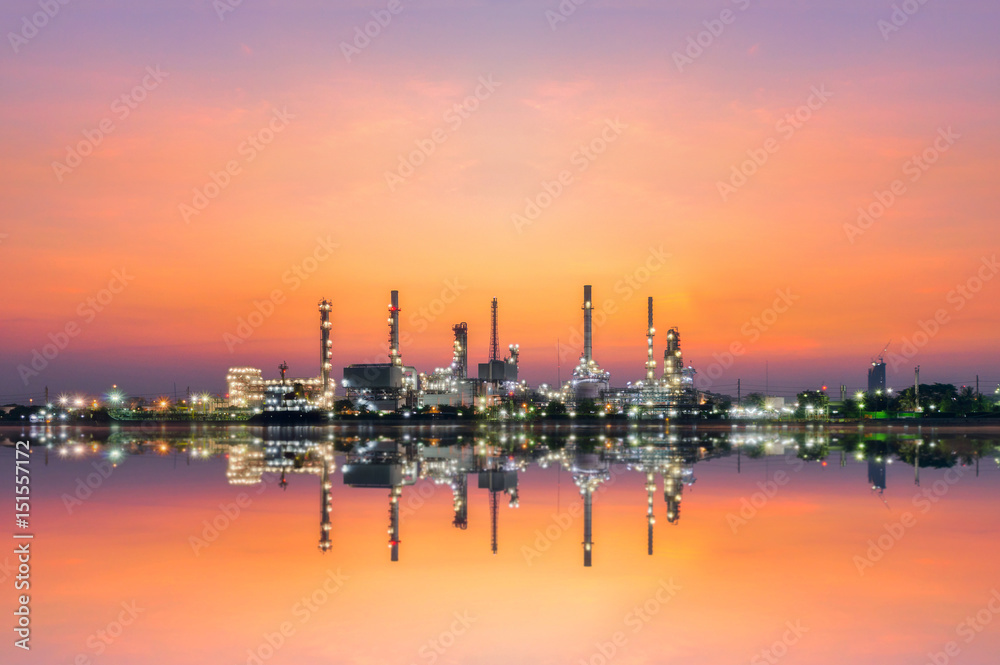 oil refinery industry at morning golden hour with water reflection. oil refinery industry at morning golden hour with water reflection.