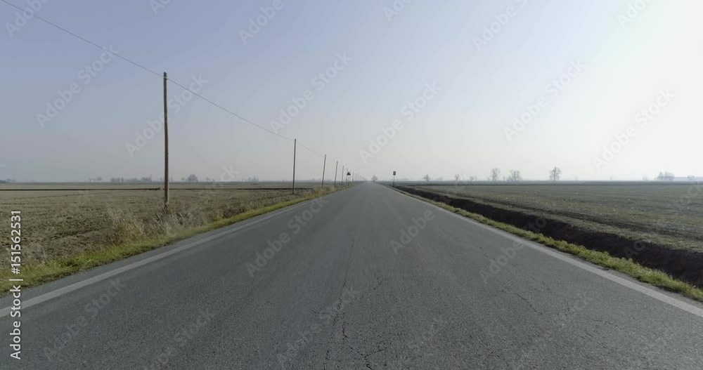 aerial empty paved road in rural fields. forward follow 4k drone video aerial empty paved road in rural fields. forward follow 4k drone video