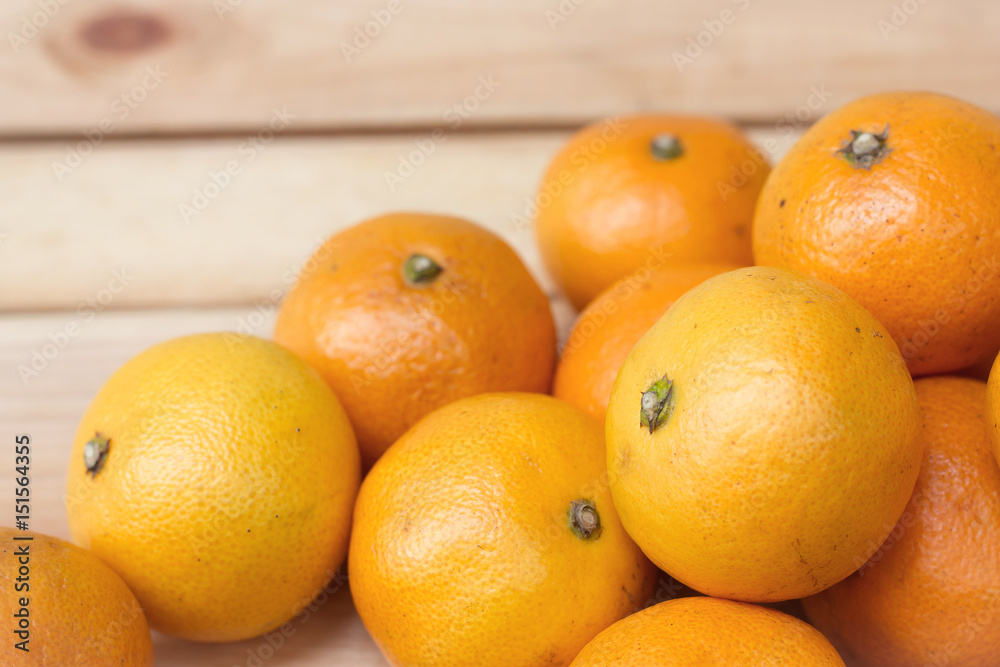 Fresh oranges from orchard on a wooden table. Fresh oranges from orchard on a wooden table.