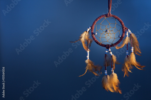 dreamcatcher on a color background photo