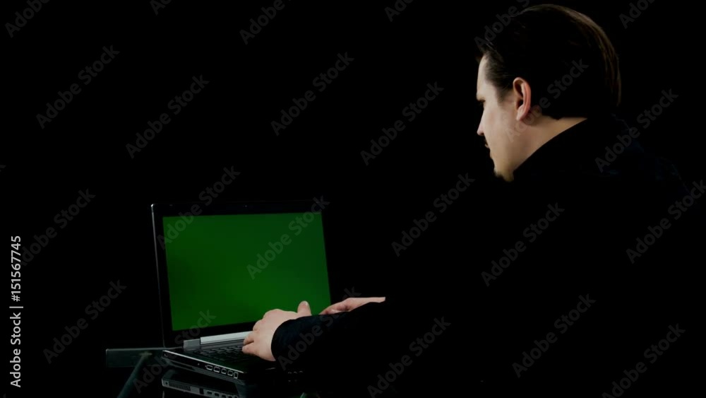 A young businessman is writing an email and he can't believe his eyes when he sees something on the screen. A young businessman is writing an email and he can't believe his eyes when he sees something on the screen.