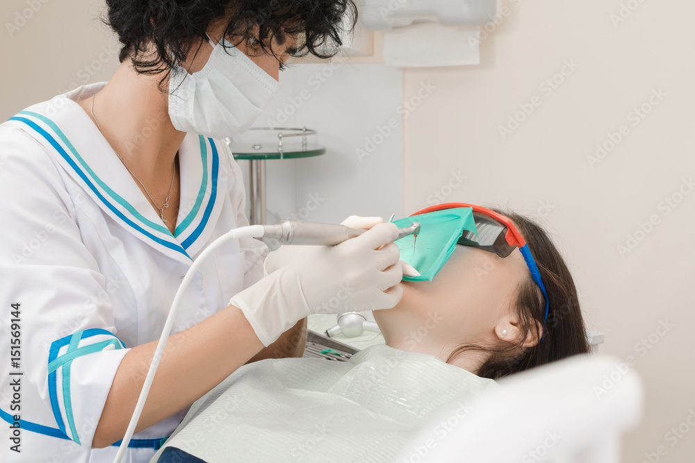 Naklejka premium patient on reception at the dentist. dental treatment