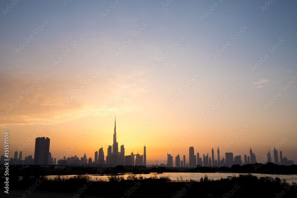Dubai Downtown skyline at sunset.