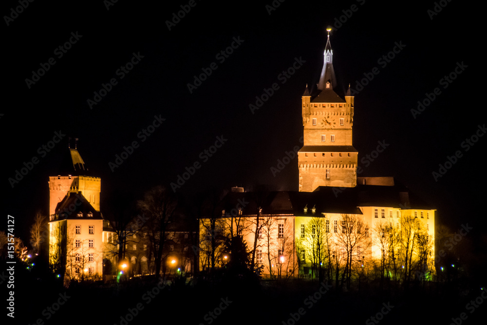 Old german castle tower clock palace at night