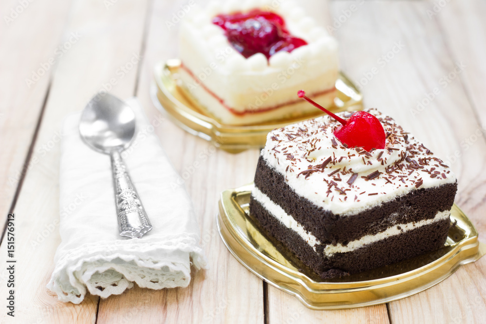 Cake with chocolate and strawberry cake on wood background. Cake with chocolate and strawberry cake on wood background.