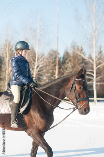 Ten years girl riding a horse in winter © GrasePhoto