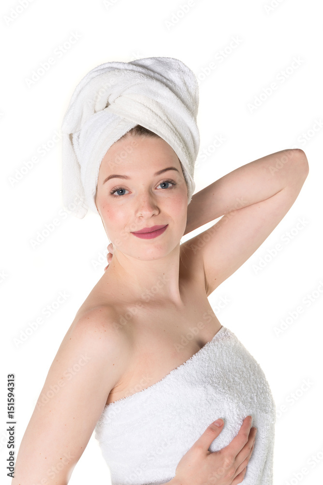 Young beautiful, pretty girl with towel. Ready for massage and skin cosmetic treatment. Studio portrait shot. Pure white background Young beautiful, pretty girl with towel. Ready for massage and skin cosmetic treatment. Studio portrait shot. Pure white background