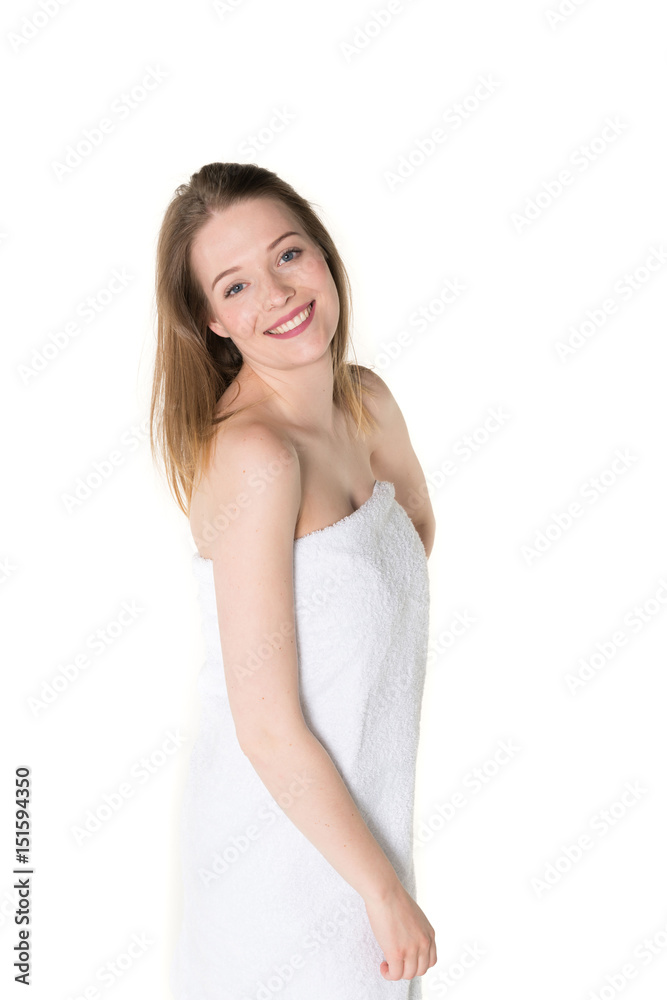 Young beautiful, pretty girl with towel. Ready for massage and skin cosmetic treatment. Studio portrait shot. Pure white background Young beautiful, pretty girl with towel. Ready for massage and skin cosmetic treatment. Studio portrait shot. Pure white background