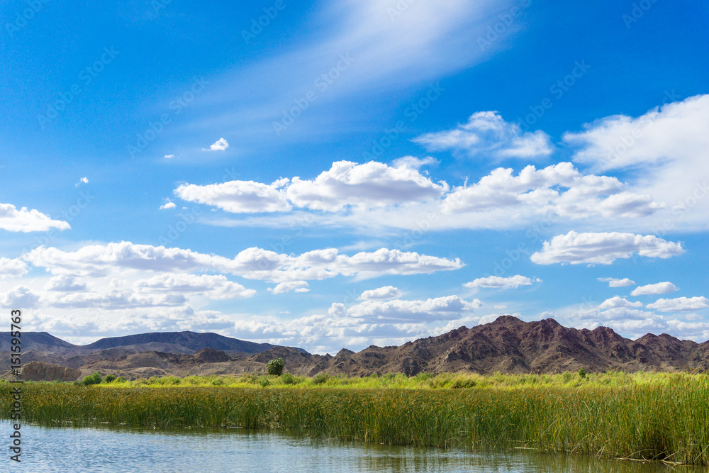 Colorado river and mountains under blue sky in Yuma Arizona
