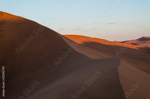 Climbing Big Daddy Dune during Sunrise  Desert Landscape at Dawn  Sossusvlei  Namibia