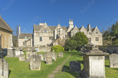 Historic Buildings Seeing Through the Graveyard in Cotswolds of England photo