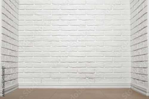 white brick wall with tiled floor  abstract background photo
