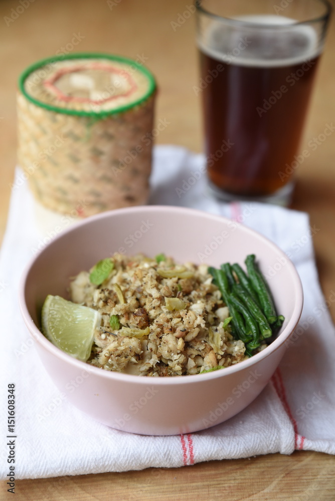 Bowl of food served with beer glass on the table Bowl of food served with beer glass on the table