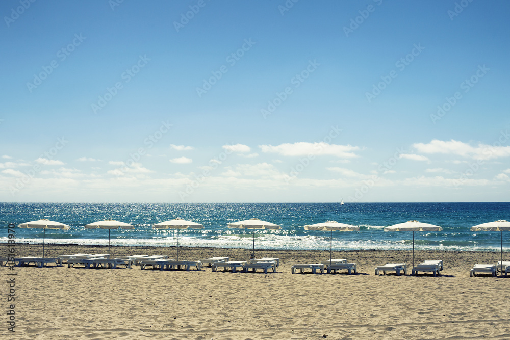 umbrellas and chairs in alicante beach.Spain