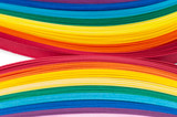 Colored strips of paper for quilling rainbow colors, close-up