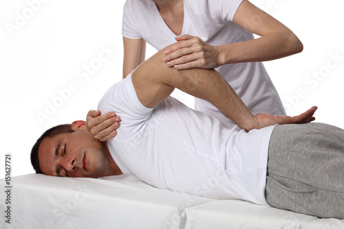 Chiropractic, osteopathy, manual therapy, acupressure. Therapist doing healing treatment on man's back. Alternative medicine, pain relief concept. Rehabilitation after Back Injury, Physical therapy.