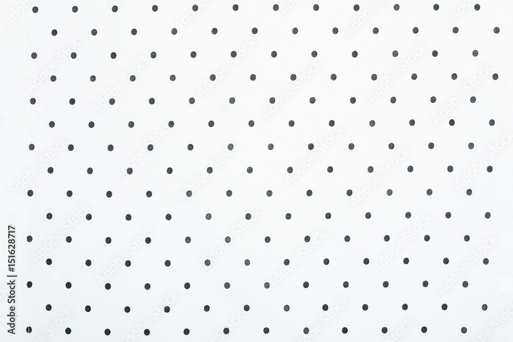 White dotted fabric pattern as background or texture White dotted fabric pattern as background or texture