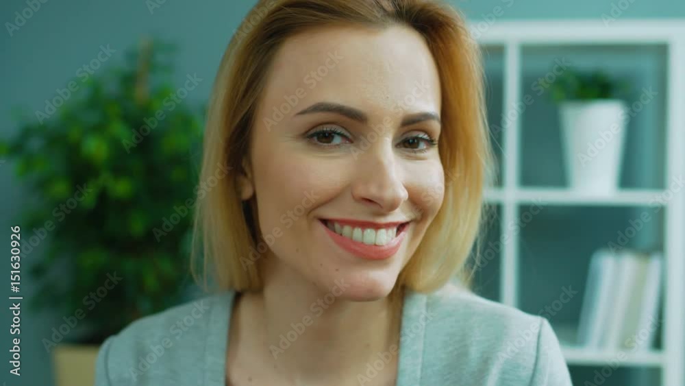Portrait of beautiful blonde woman posing on camera. Emotional business woman smiling on camera. Close up. Portrait of beautiful blonde woman posing on camera. Emotional business woman smiling on camera. Close up.