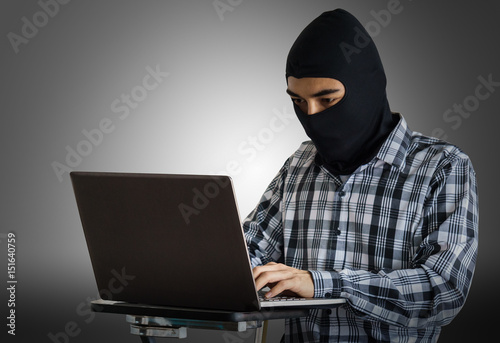 Hacker using laptop. Hacking the Internet.