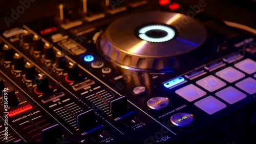 DJ's turntable lights flicker during a  college party