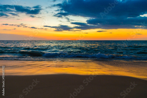 Fototapeta Naklejka Na Ścianę i Meble -  Sunset over sea beach wave scene
