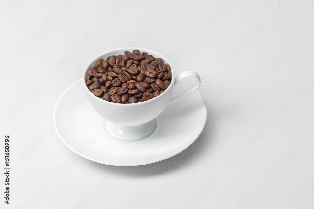 Coffee cup filled with coffee beans Coffee cup filled with coffee beans